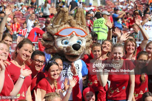 Mascot Zabivaka poses with volunteers prior to the 2018 FIFA World Cup Russia Round of 16 match between Spain and Russia at Luzhniki Stadium on July...