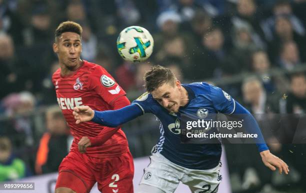 Schalke's Bastian Oczipka and Cologne's Kevin Goden in action during the German DFB Cup soccer match between FC Schalke 04 and 1. FC Cologne in the...