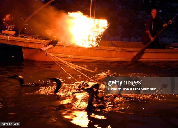 Usho', cormorant masters use cormorants to catch fishes as the 'Ukai' cormorant fishing at Ujigawa River on July 1, 2018 in Uji, Kyoto, Japan.