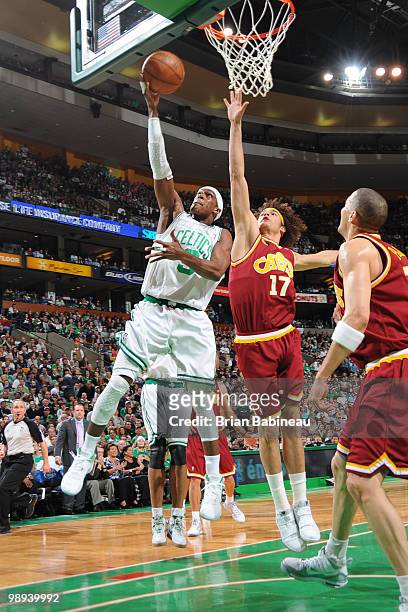 Rajon Rondo of the Boston Celtics takes the shot against Anderson Varejao of the Cleveland Cavaliers in Game Four of the Eastern Conference...