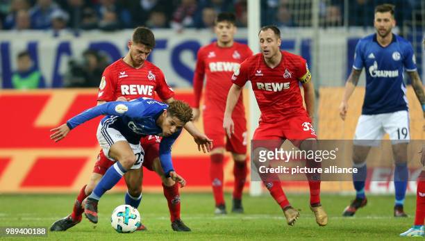 Cologne's Salih Ozcan and Schalke's Amine Harit vie for the ball during the German DFB Cup soccer match between FC Schalke 04 and 1. FC Cologne in...
