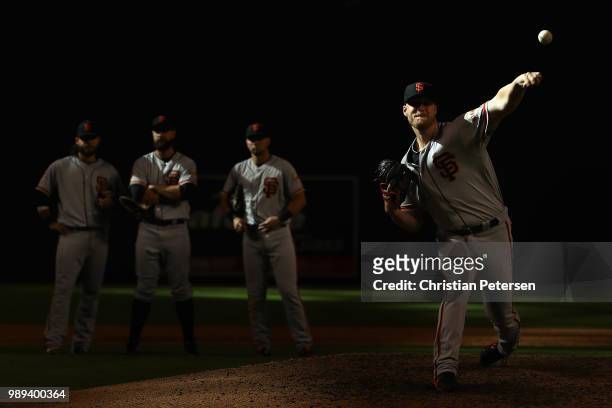 Relief pitcher Will Smith of the San Francisco Giants throws a warm-up pitch during the ninth inning of the MLB game against the Arizona Diamondbacks...