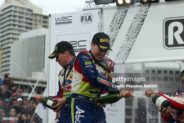 Jari Matti Latvala of Finland and co-driver Mikka Anttila of Finland celebrate their first position as a winner of the WRC Rally of New Zealand on...