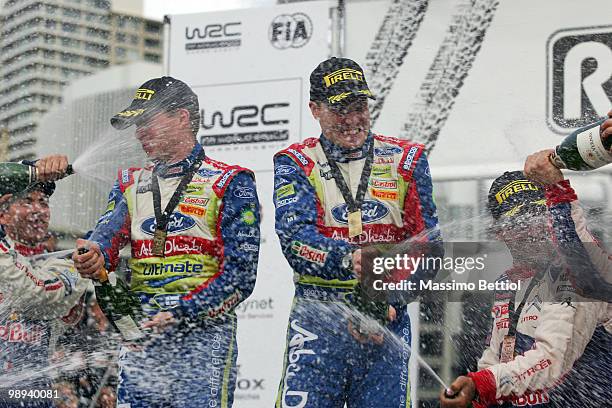 Jari Matti Latvala of Finland and co-driver Mikka Anttila of Finland celebrate their first position as a winner of the WRC Rally of New Zealand on...