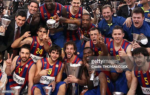 Regal Barcelona's players celebrate with their trophies after winning the Euroleague basketball final match against Olympiacos in Paris-Bercy...