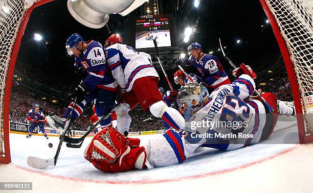 Vasili Koshechkin goalkeeper of Russia saves the shot of Andrej Podkonicky of Slovakia during the IIHF World Championship group A match between...