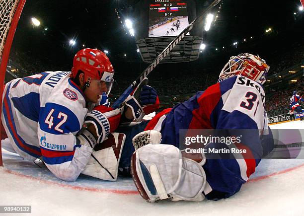 Peter Budaj, goalkeeper of Slovakia clashes with Artyom Anisimov of Russia during the IIHF World Championship group A match between Slovakia and...