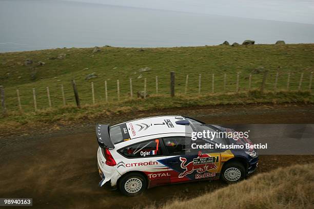 Sebastien Ogier of France and co-driver Julien Ingrassia of France drive their Citroen C4 Junior Team during Leg3 of the WRC Rally of New Zealand on...