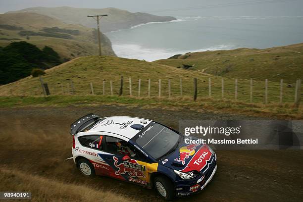 Sebastien Ogier of France and co-driver Julien Ingrassia of France drive their Citroen C4 Junior Team during Leg3 of the WRC Rally of New Zealand on...