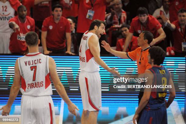 Olympiacos Piraeus's Theodoros Papaloukas speaks to a referee during the Euroleague basketball final match between Olympiacos Piraeus and Regal...