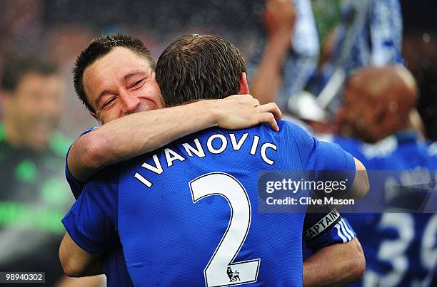 John Terry and Branislav Ivanovic of Chelsea celebrate as they win the title after the Barclays Premier League match between Chelsea and Wigan...