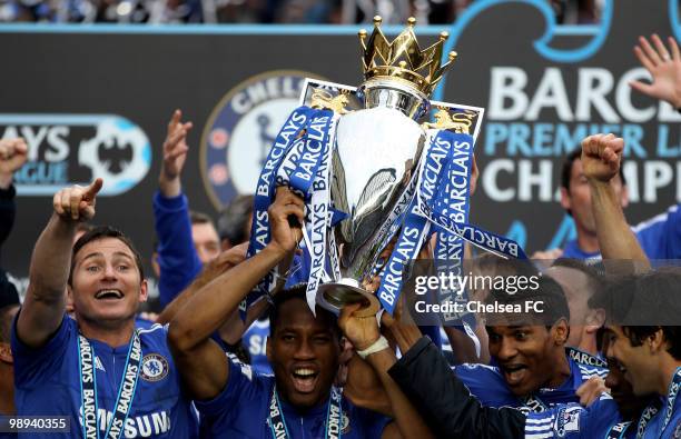 Chelsea's Frank Lampard, Didier Drogba and Florent Malouda celebrate with the trophy after winning the league with an 8-0 victory during the Barclays...