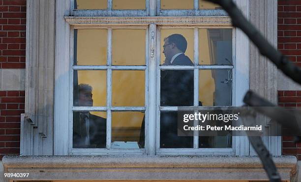 Ed Llewellyn , Chief of Staff to Conservative Party leader David Cameron, talks to Policy Chief Oliver Letwin in David Cameron's office in Parliament...