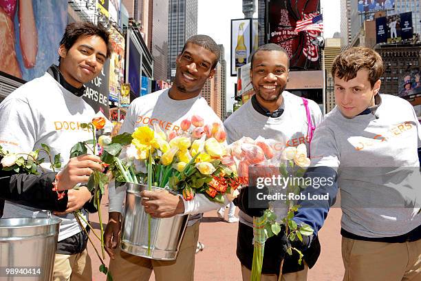 Docker's crew members hand out flowers on Mother's Day during the ''DOCKERS 10,000 Acts of Chivalry'' in Manhattan on May 9, 2010 in New York City.