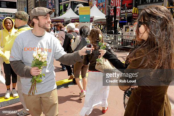 Docker's crew members hand out flowers on Mother's Day during the ''DOCKERS 10,000 Acts of Chivalry'' in Manhattan on May 9, 2010 in New York City.