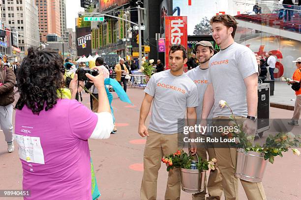 Docker's crew members hand out flowers on Mother's Day during the ''DOCKERS 10,000 Acts of Chivalry'' in Manhattan on May 9, 2010 in New York City.