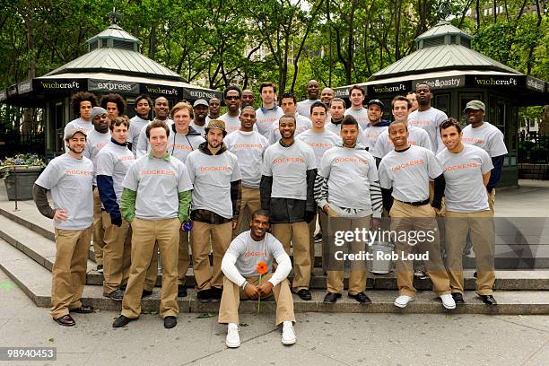 Docker's crew members hand out flowers on Mother's Day during the ''DOCKERS 10,000 Acts of Chivalry'' in Manhattan on May 9, 2010 in New York City.