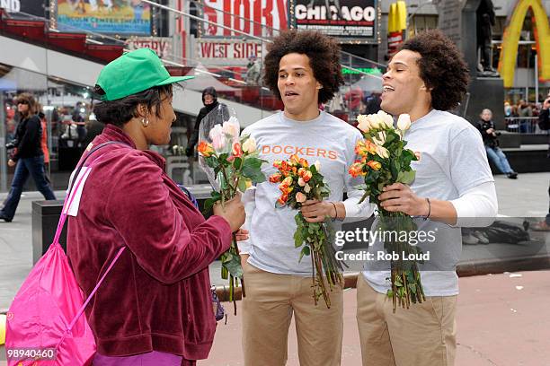 Docker's crew members hand out flowers on Mother's Day during the ''DOCKERS 10,000 Acts of Chivalry'' in Manhattan on May 9, 2010 in New York City.