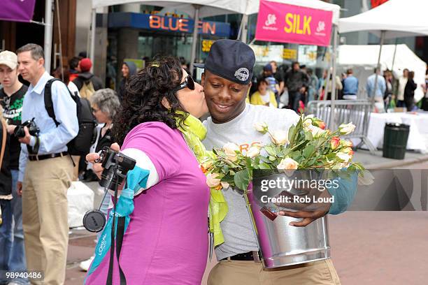 Docker's crew members hand out flowers on Mother's Day during the ''DOCKERS 10,000 Acts of Chivalry'' in Manhattan on May 9, 2010 in New York City.