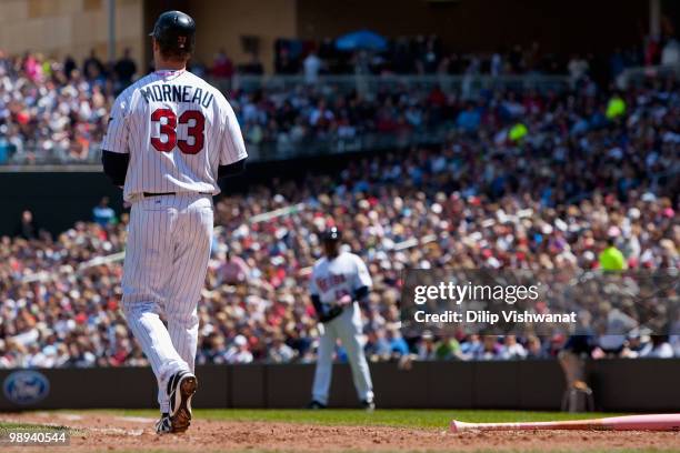 Justin Morneau of the Minnesota Twins is out on strikes against the Baltimore Orioles at Target Field on May 9, 2010 in Minneapolis, Minnesota. The...