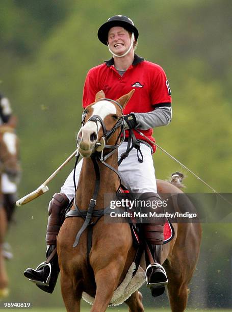 Prince Harry plays in the Audi Polo Challenge polo match at Coworth Polo Club on May 9, 2010 in Ascot, England.