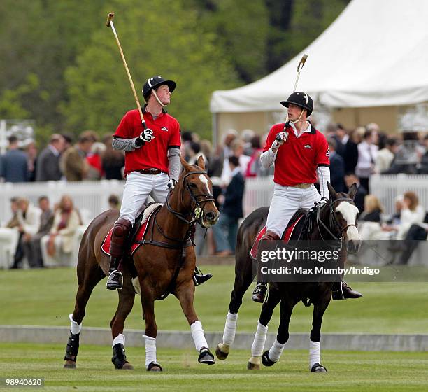 Prince Harry and HRH Prince William play in the Audi Polo Challenge polo match at Coworth Park Polo Club on May 9, 2010 in Ascot, England.