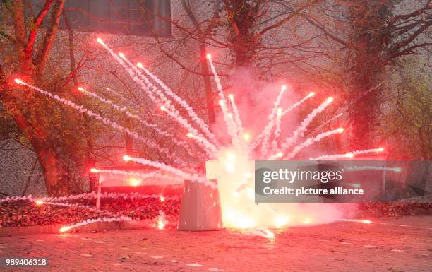 Firework rocket explodes during a presentation of the firebrigade on the dangers of wrong usage of fireworks on New Year's Eve in Hamburg, Germany,...