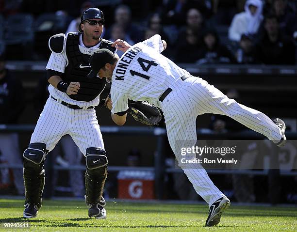 Paul Konerko hangs on to the ball to record the out after colliding with A.J. Pierzynski of the Chicago White Sox on a pop up by Alex Gonzalez the...