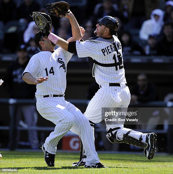 Paul Konerko hangs on to the ball to record the out after colliding with A.J. Pierzynski of the Chicago White Sox on a pop up by Alex Gonzalez the...