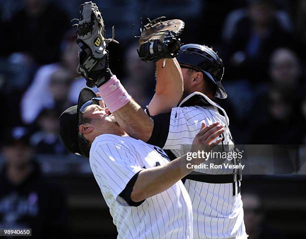 Paul Konerko hangs on to the ball to record the out after colliding with A.J. Pierzynski of the Chicago White Sox on a pop up by Alex Gonzalez the...