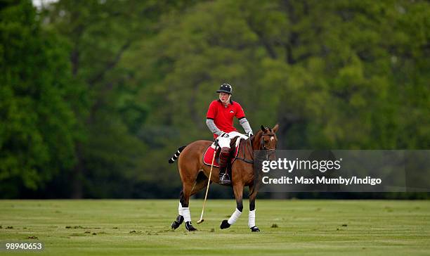 Prince Harry plays in the Audi Polo Challenge polo match at Coworth Polo Club on May 9, 2010 in Ascot, England.