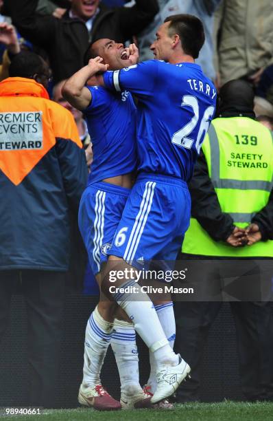 Ashley Cole of Chelsea celebrates with John Terry as he scores their eighth goal during the Barclays Premier League match between Chelsea and Wigan...