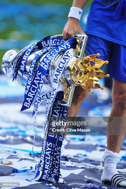 Joe Cole of Chelsea celebrates with the trophy as they win the title after the Barclays Premier League match between Chelsea and Wigan Athletic at...