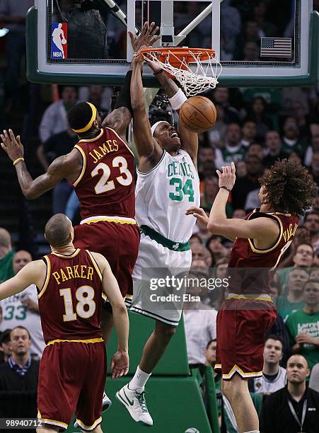 Paul Pierce of the Boston Celtics dunks the ball as LeBron James and Anderson Varejao of the Cleveland Cavaliers defend during Game Four of the...