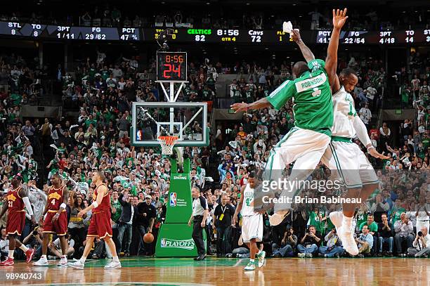 Glen Davis and Nate Robinson of the Boston Celtics celebrate after scoring against the Cleveland Cavaliers in Game Four of the Eastern Conference...