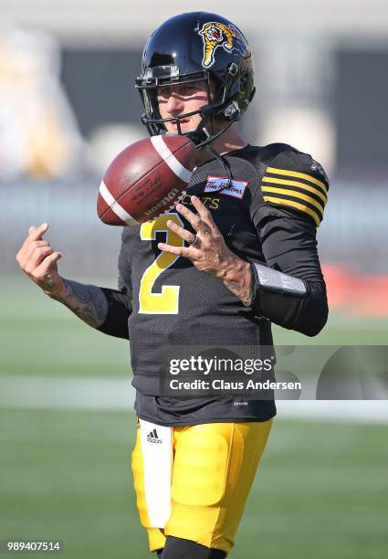 Johnny Manziel of the Hamilton Tiger-Cats warms up prior to action against the Winnipeg Blue Bombers in a CFL game at Tim Hortons Field on June 29,...