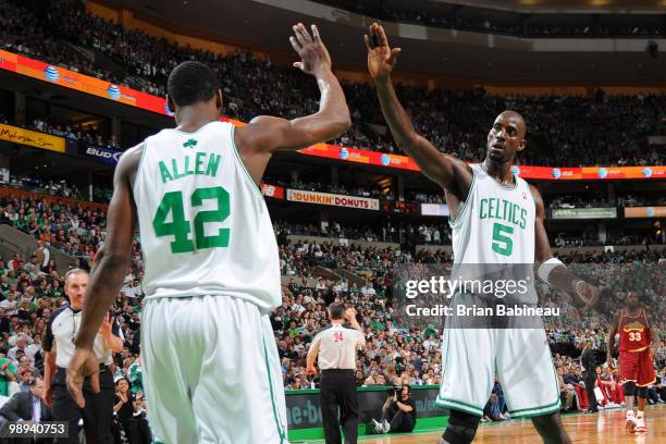 Kevin Garnett and Tony Allen of the Boston Celtics celebrate after scoring against the Cleveland Cavaliers in Game Four of the Eastern Conference...