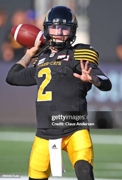 Johnny Manziel of the Hamilton Tiger-Cats warms up prior to action against the Winnipeg Blue Bombers in a CFL game at Tim Hortons Field on June 29,...