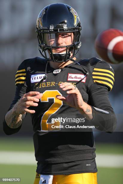 Johnny Manziel of the Hamilton Tiger-Cats warms up prior to action against the Winnipeg Blue Bombers in a CFL game at Tim Hortons Field on June 29,...