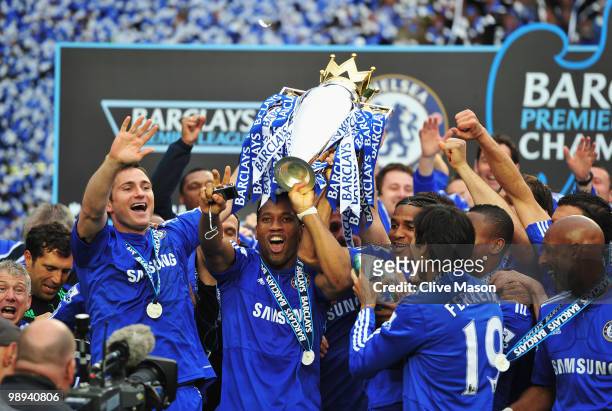 Chelsea players celebrate with the trophy after the Barclays Premier League match between Chelsea and Wigan Athletic at Stamford Bridge on May 9,...