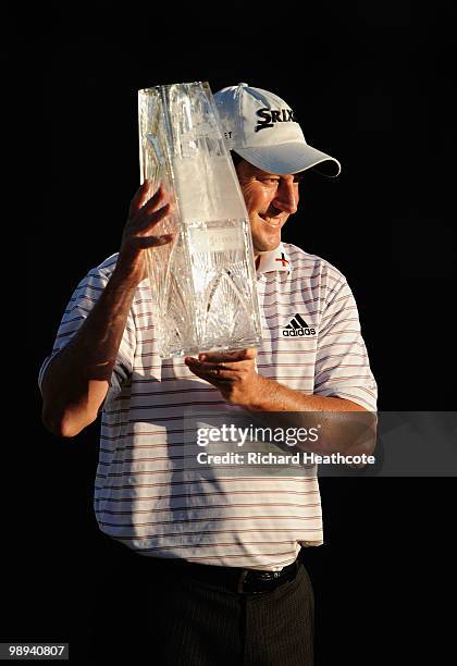 Tim Clark of South Africa smiles while holding the trophy after winning THE PLAYERS Championship held at THE PLAYERS Stadium course at TPC Sawgrass...