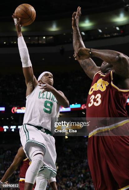 Rajon Rondo of the Boston Celtics drives for the net as Shaquille O'Neal of the Cleveland Cavaliers defends during Game Four of the Eastern...