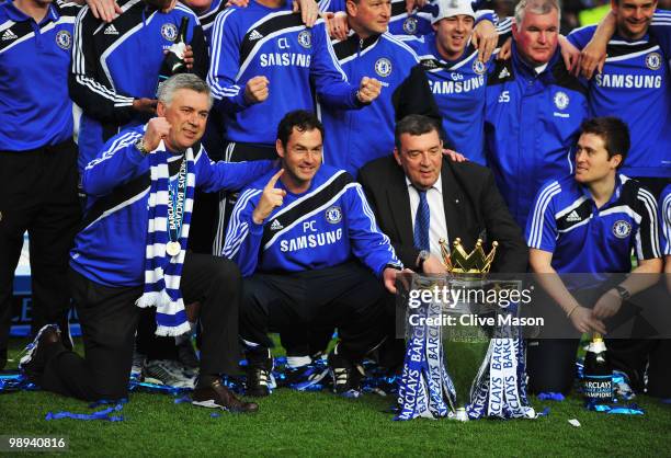 Manager Carlo Ancelotti and Chelsea coaching staff celebrate as they win the title after the Barclays Premier League match between Chelsea and Wigan...