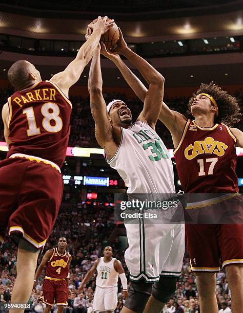 Rasheed Wallace of the Boston Celtics fights for the rebound with Anderson Varejao and Anthony Parker of the Cleveland Cavaliers during Game Four of...