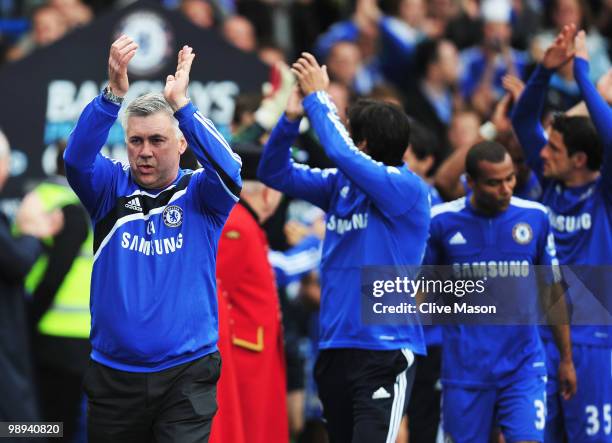 Manager Carlo Ancelotti leads his team as they celebrate winning the title after the Barclays Premier League match between Chelsea and Wigan Athletic...