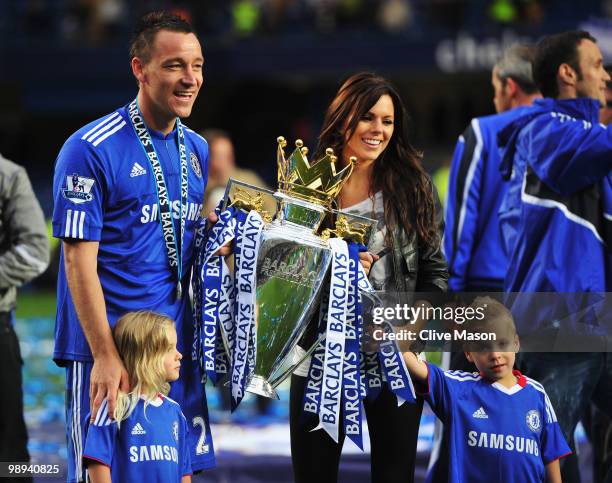 John Terry of Chelsea celebrates with wife Toni and his children as they win the title after the Barclays Premier League match between Chelsea and...