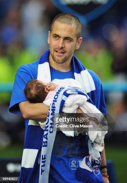 Joe Cole of Chelsea celebrates with baby daughter Ruby as they win the title after the Barclays Premier League match between Chelsea and Wigan...