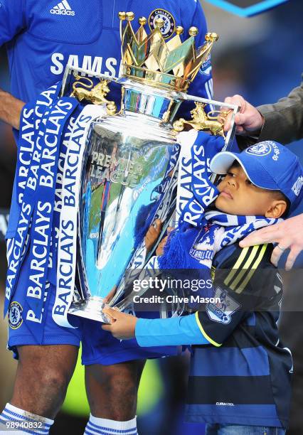 Aaron Malouda, son of Chelsea midfielder Florent celebrates with the trophy after the Barclays Premier League match between Chelsea and Wigan...