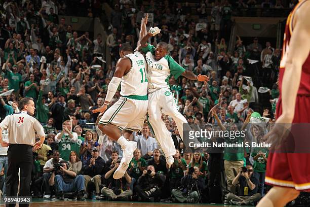 Glen Davis and Nate Robinson of the Boston Celtics celebrate a big basket by Davis while playing against the Cleveland Cavaliers in Game Four of the...