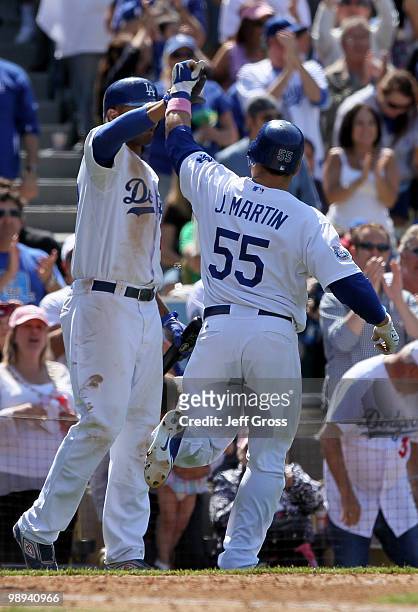 Russell Martin of the Los Angeles Dodgers is congratulated by teammate Matt Kemp after hitting a solo homerun in the eighth inning against the...